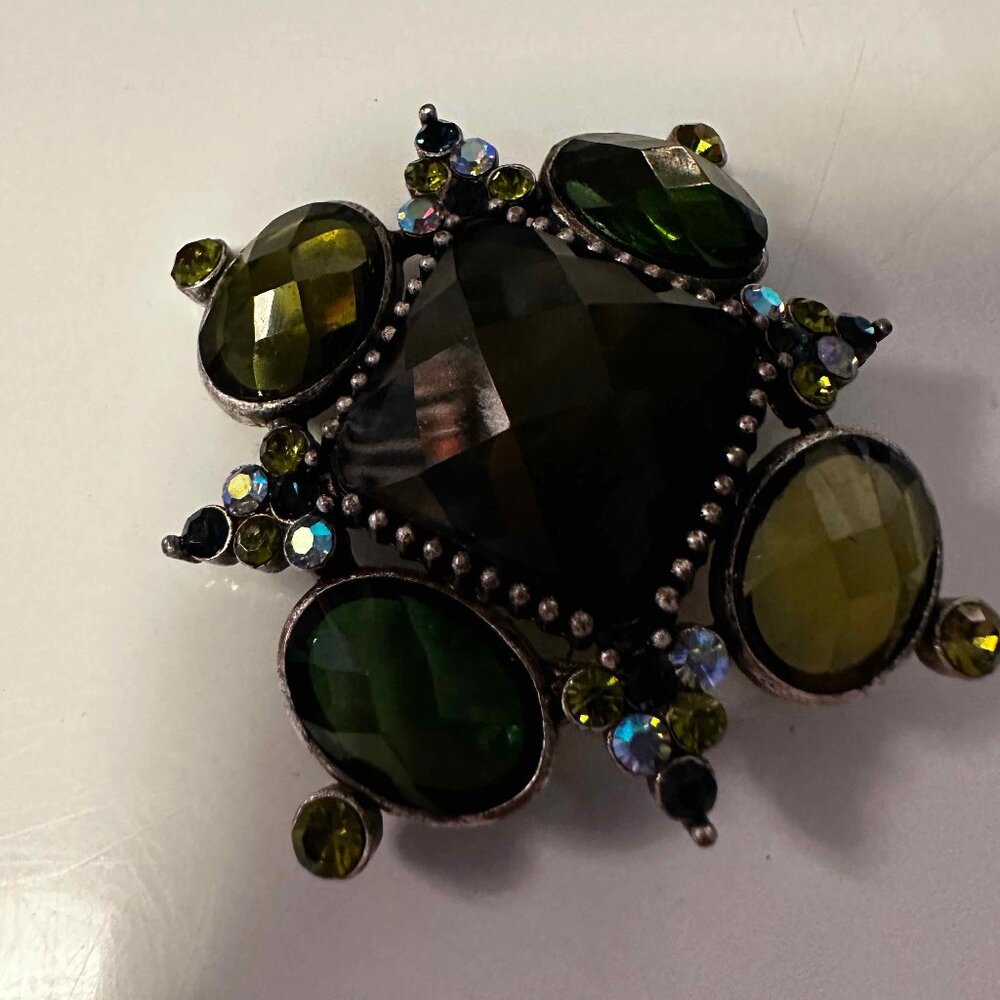 Green brooches